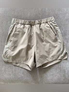 Outdoor Voices Men’s High Stride 7" Athletic Shorts with Pockets, Lined & in Tan